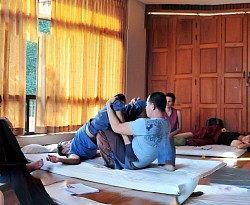Yan teaching stretches in an advanced course